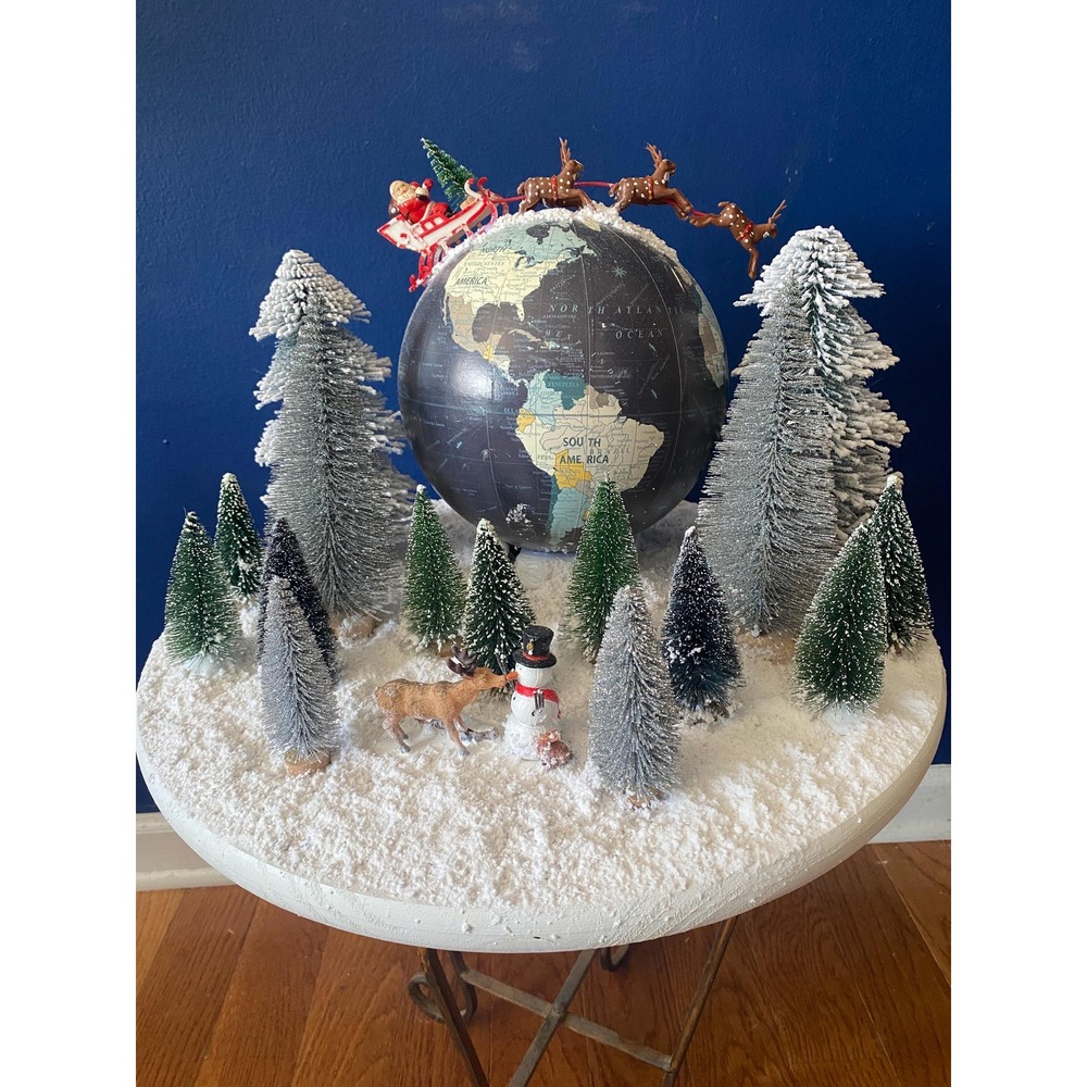 Vintage globe with Santa and reindeer